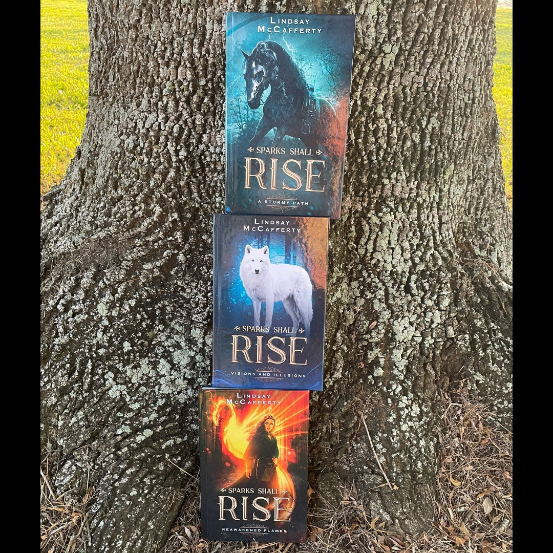 Reawakened Flames, Visions and Illusions, and A Stormy Path stacked on top of each other against a tree